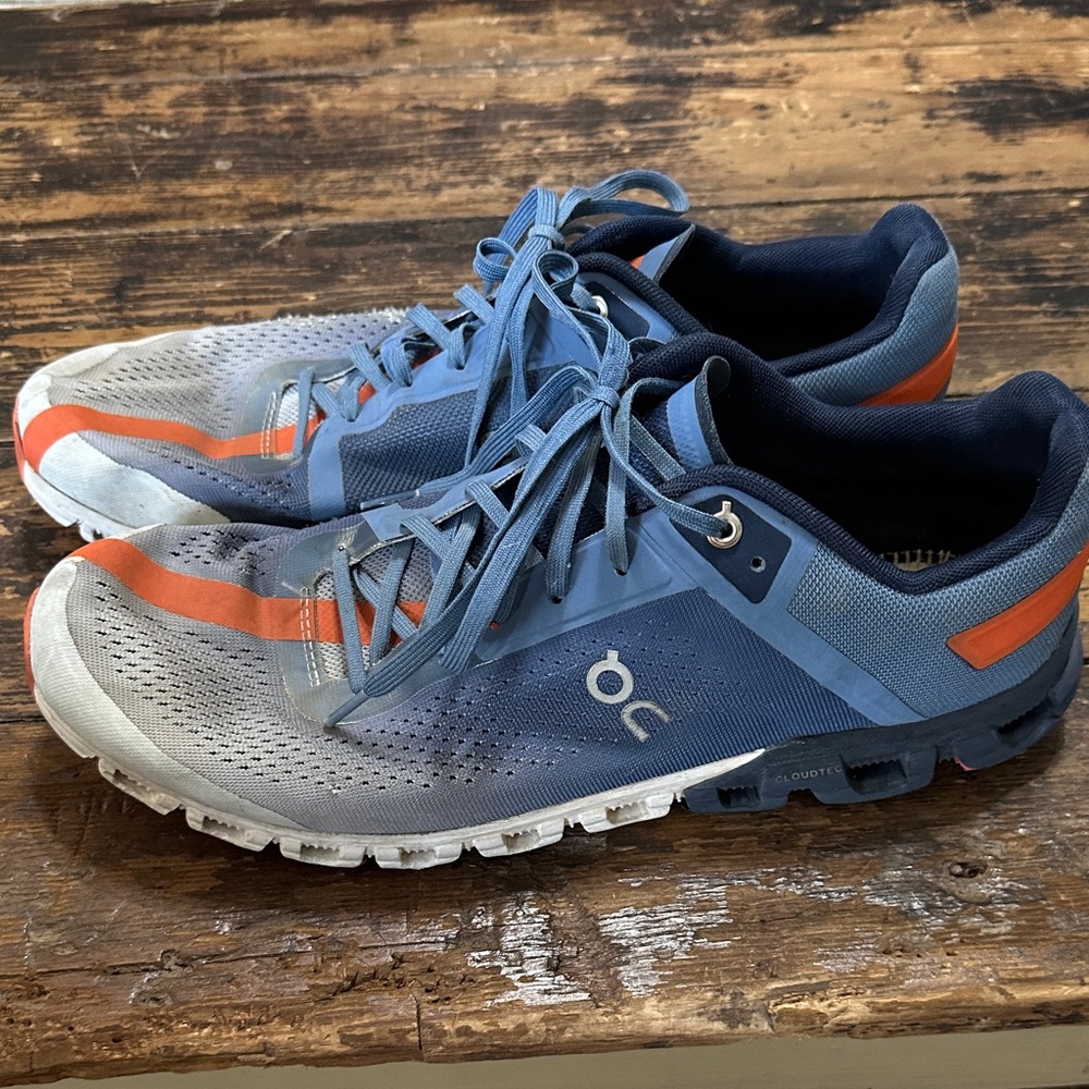 On Running Men’s Cloud Sneakers in Blue with Orange Accents